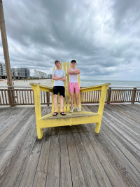 My Friend and I on a big yellow chair
    at the beach.